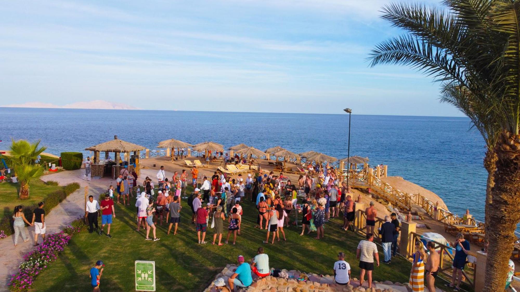 Safir Sharm Waterfalls Resort Exterior photo Tourists at a beach in Sharm El Sheikh