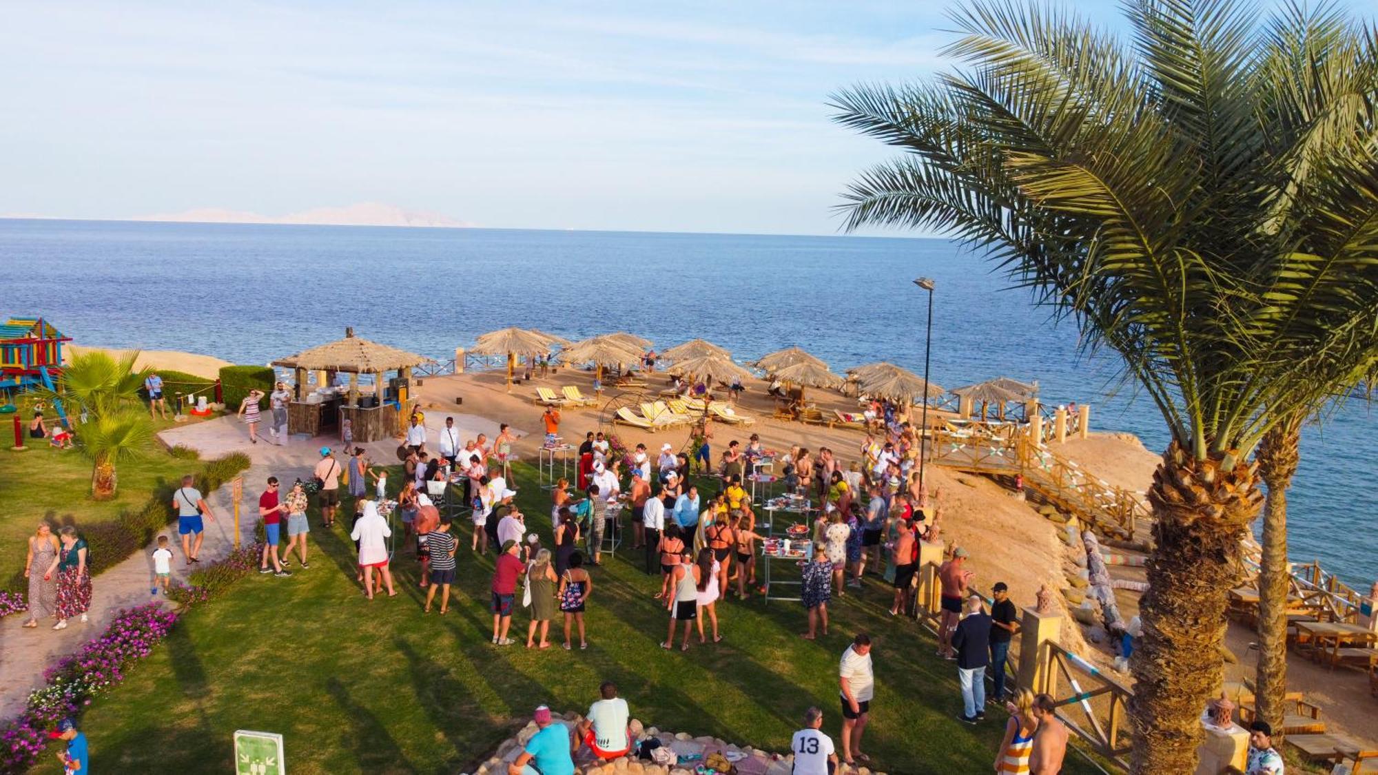 Safir Sharm Waterfalls Resort Exterior photo Tourists at a beach in Sharm El Sheikh