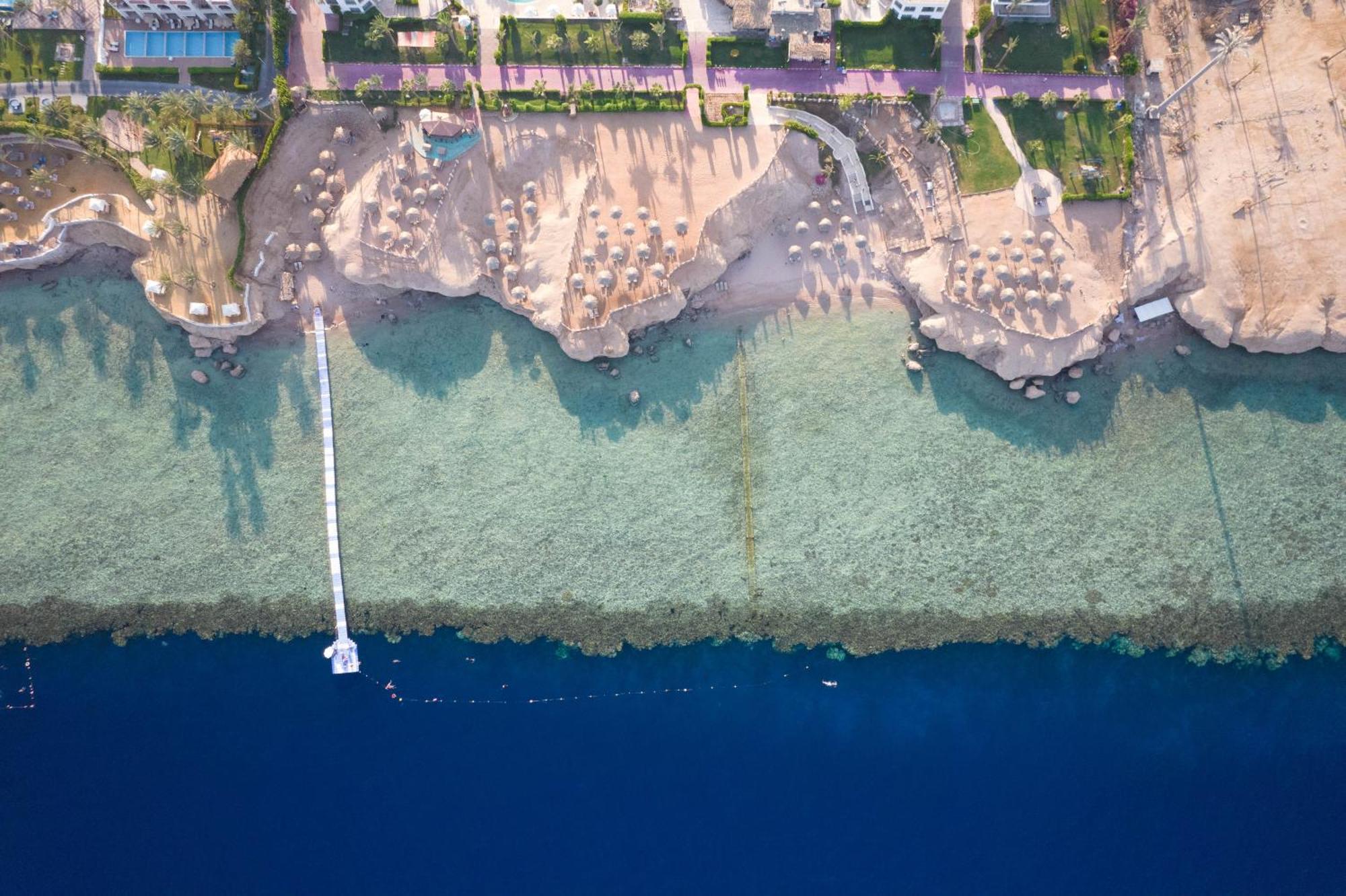 Safir Sharm Waterfalls Resort Exterior photo Aerial view of the beach